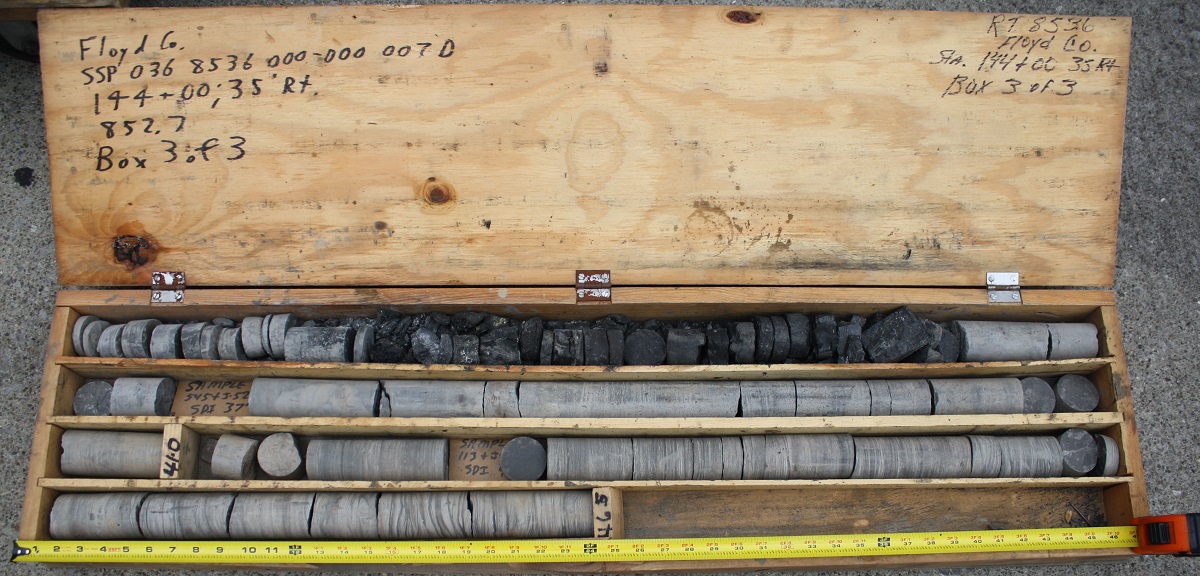 Core is temporarily or permanently stored in cardboard or wooden boxes. Labeling core numbers, location, and depths (top and bottom of box) on boxes is important. The core in this photograph was drilled through coal-bearing rocks by the Kentucky Department of Transportation.